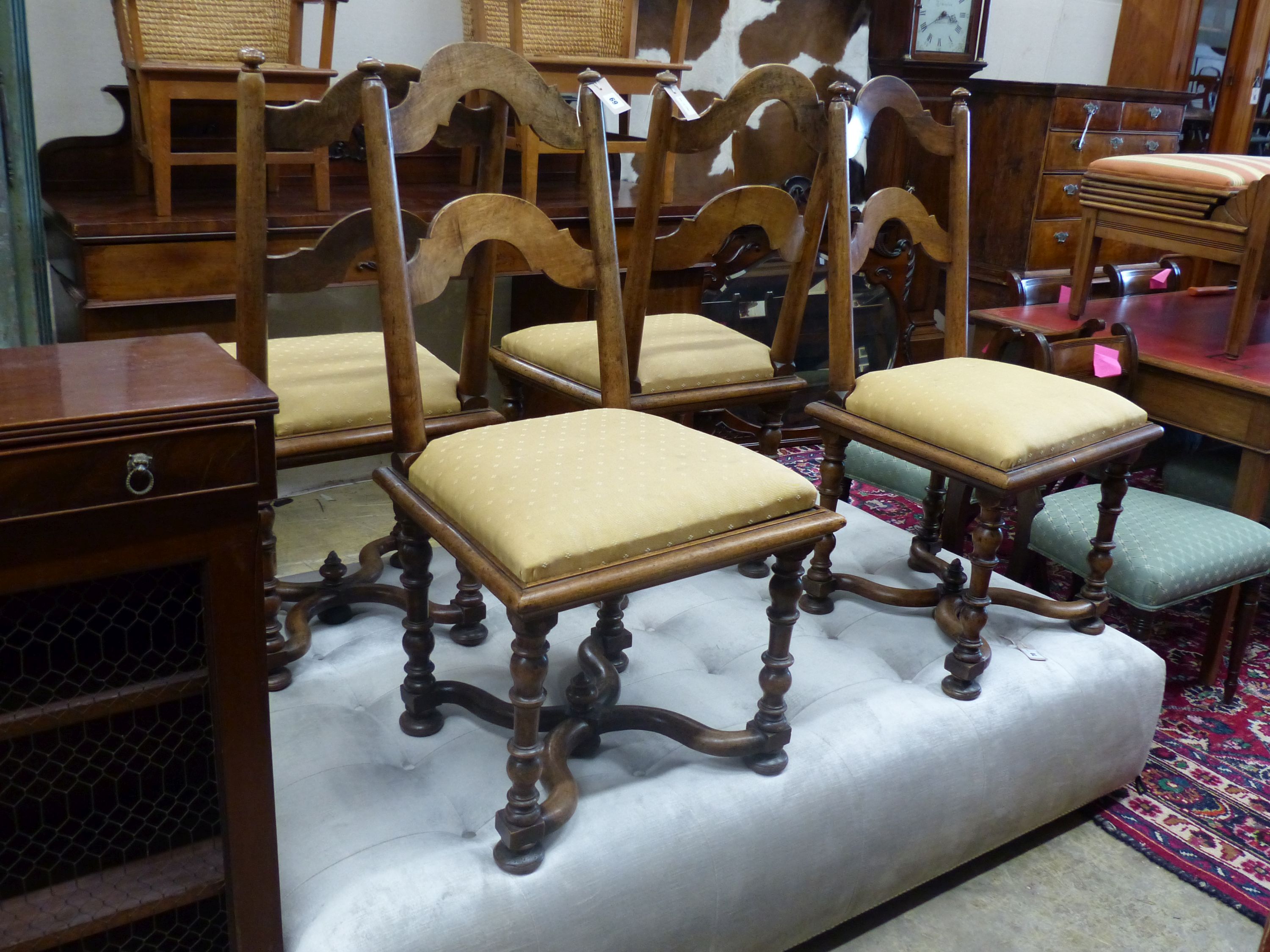 A set of four Dutch walnut side chairs